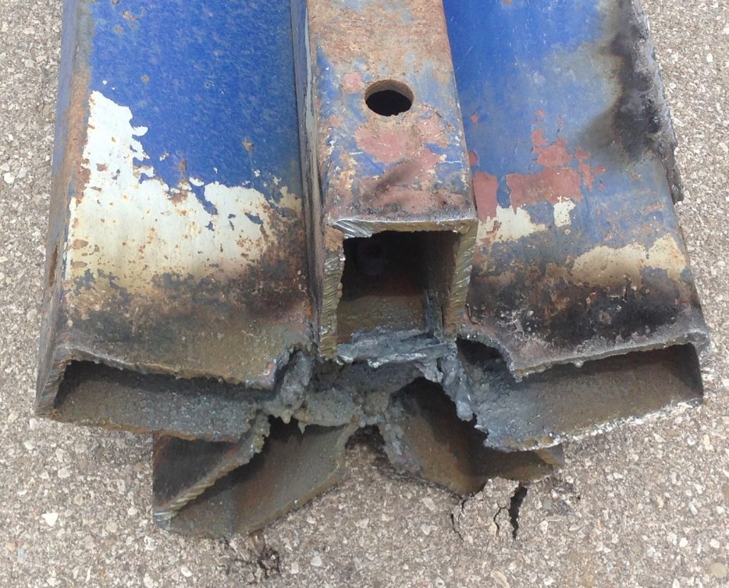 The torch cutting was necessary to remove this column consisting of 5 thick walled hollow steel rectangular tubes. Notice the openings made to cut the walls of tubes that were not accessible from outside. JW Portable Welding, London, Ontario, 2019