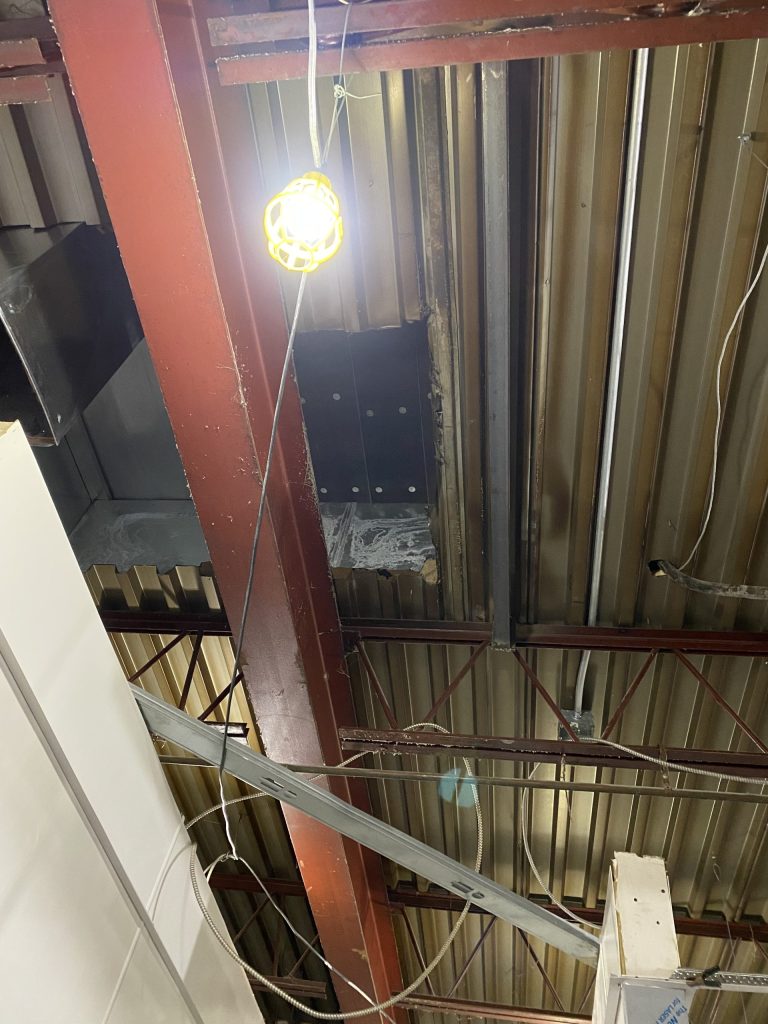 Reinforcement of open web steel joists for large HVAC unit with walls making access difficult. JW Portable Welding & Repairs 2021.