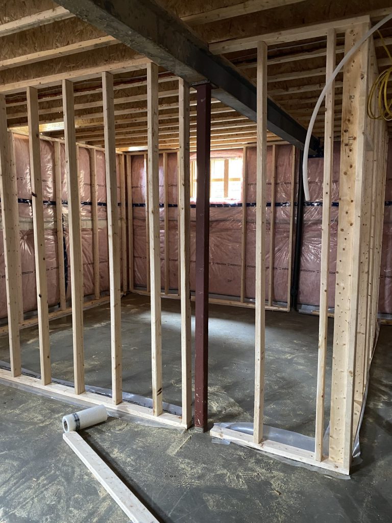 Steel post in the basement of house in construction. JW Portable Welding 2021 London, Ontario.