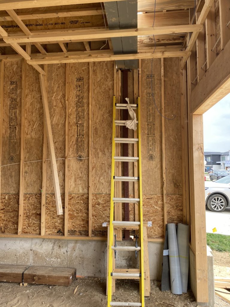 Steel post surrounded by 2x4 wood. JW Portable Welding & Repair 2021, London, Ontario.