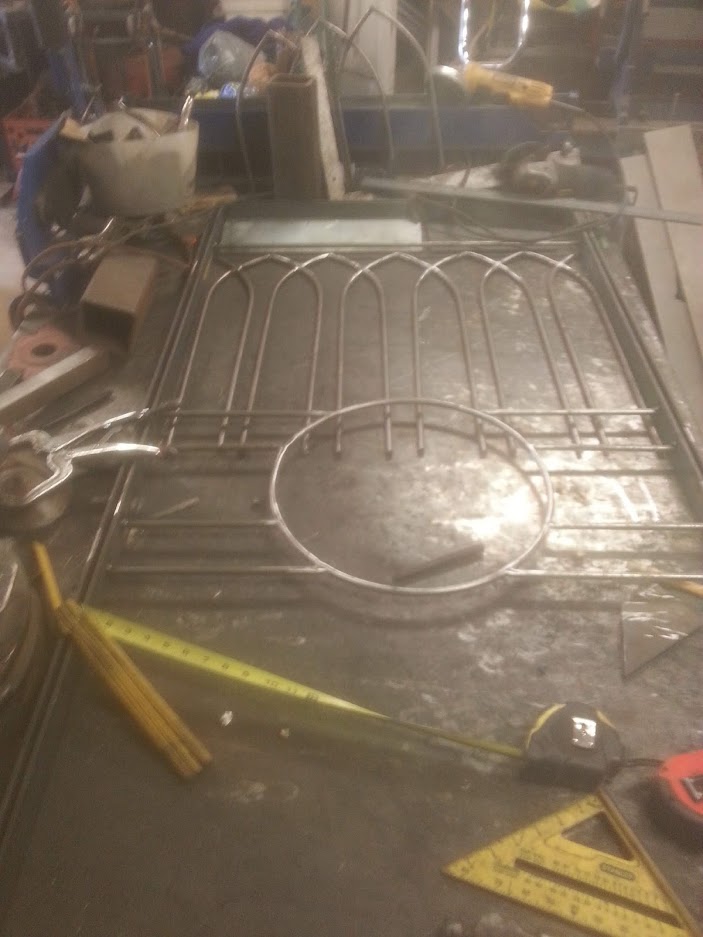 Decorative and finesse wrought iron fence in fabrication stage on the welders table. JW Portable Welding & Repairs 2019 London Ontario