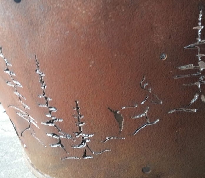 Decorative motives hand-cut in the body of fire pit grill. JW Portable Welding & Repairs 2020 London, Ontario