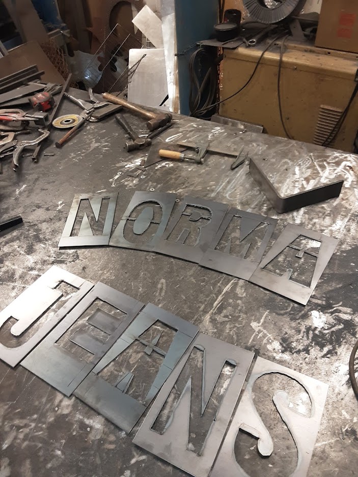 Sizing and designing the sign after the plasma cut that will be attached to the outside of our grills. JW Portable Welding & Repairs 2019, London, Ontario.
