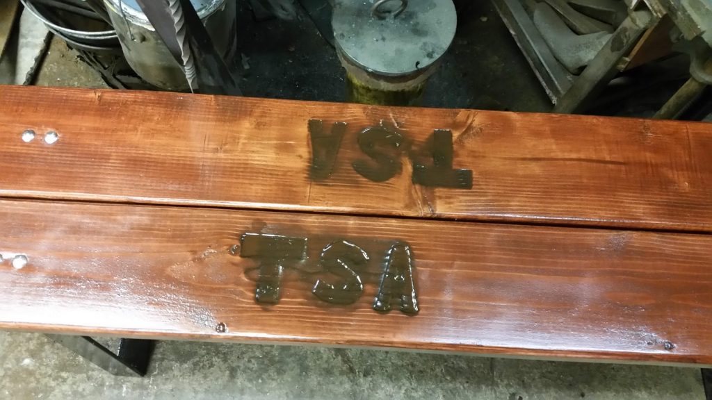 Sport club logo engraved in the planks of the bench. JW Portable Welding & Repairs 2020 London, Ontario