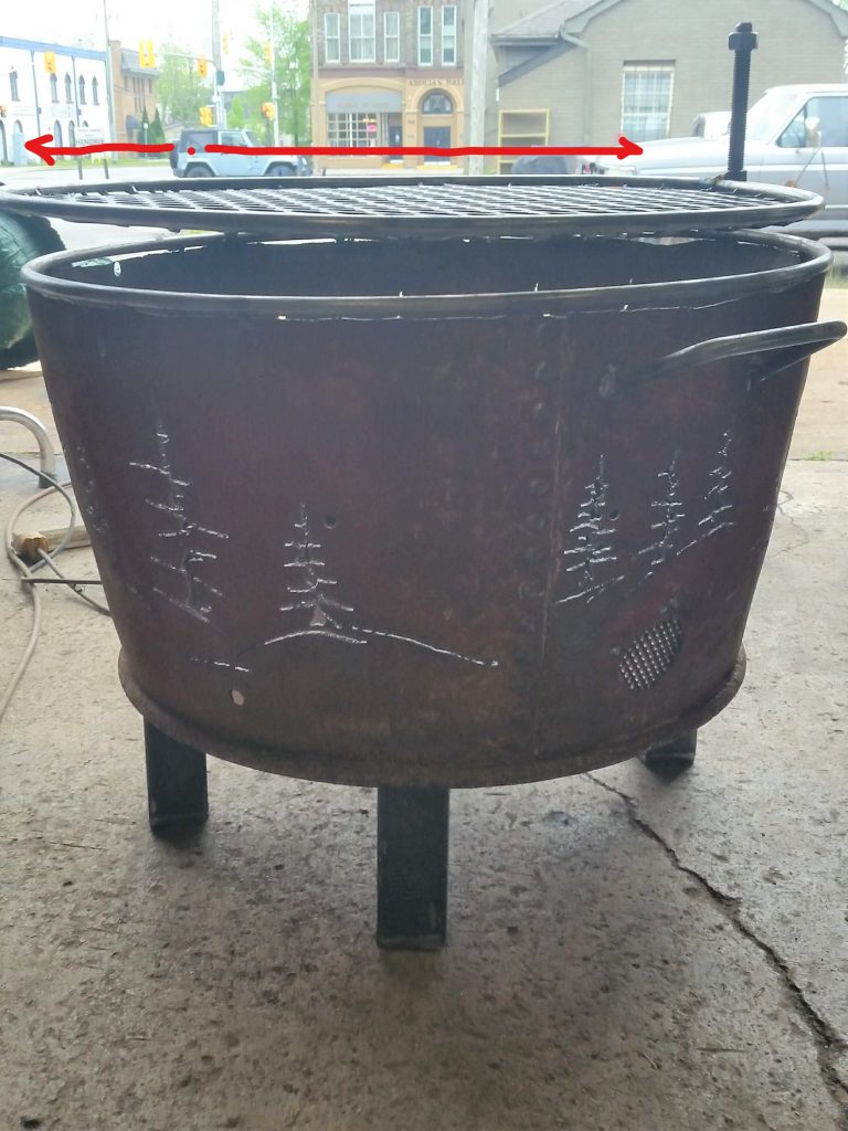 The grill of the the fire pit can be moved away to place the food on it. JW Portable Welding & Repair 2020 London, Ontario