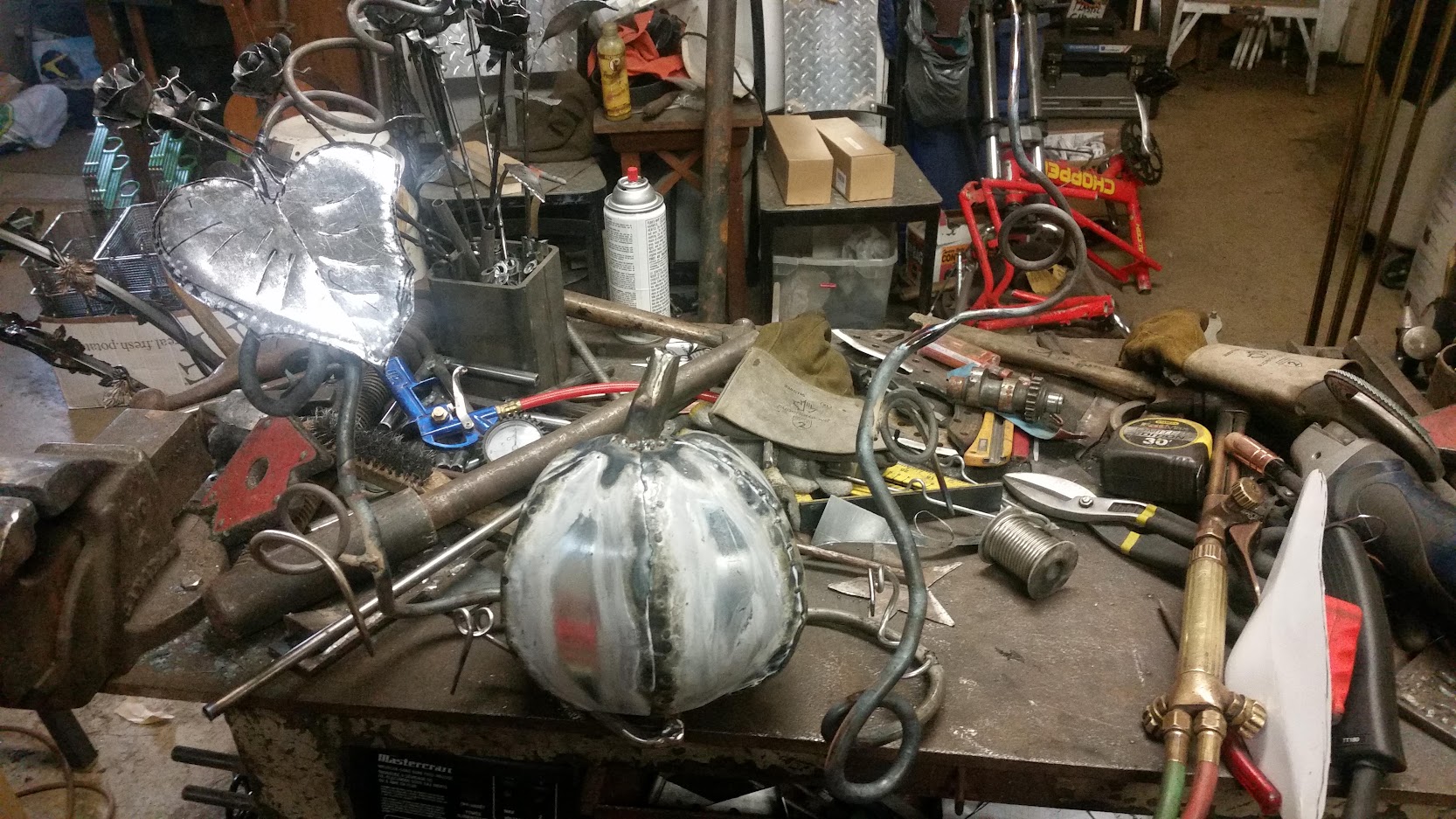 The metal pumpkin plant with one leave and a large pumpkin fruit in the middle. JW Portable Welding & Repairs 2020 London, Ontario.