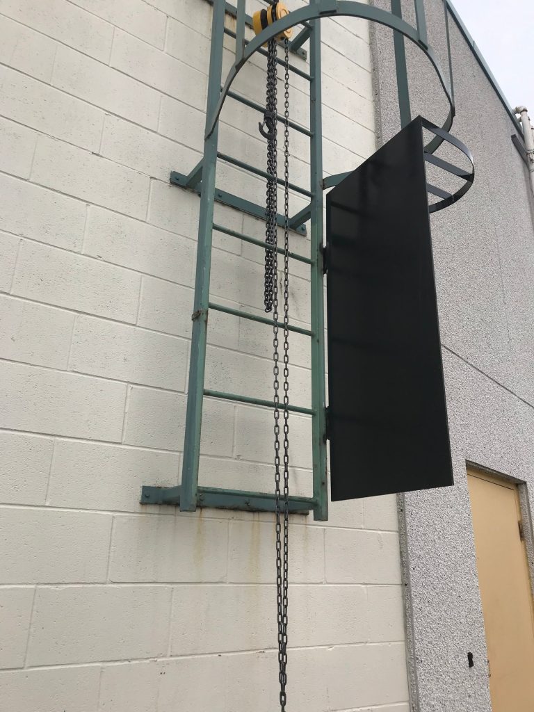 Open security door on the roof access ladder. JW Portable Welding & Repairs 2017 London, Ontario