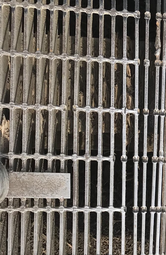 The blades are missing a connecting rods. That is why the distance between them is getting smaller. The structural integrity of grating is at the risk. It has to be fixed by welding the rod. JW Portable Welding, London, Ontario, 2021