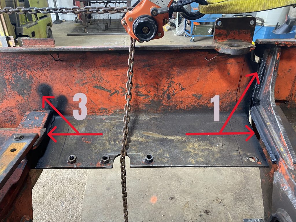 Cracks 3 and 1 marked with black paint as they are visible from inside of the skidder's frame of the right hand side of the machine. Crack 1 clearly shows a complete frame separation with the separated part sagging 1.5 inch. Each crack is marked with corresponding number and red colour arrows point to it. August 18, 2025 for JW Portable Welding & Repairs, Lucan Ontario.