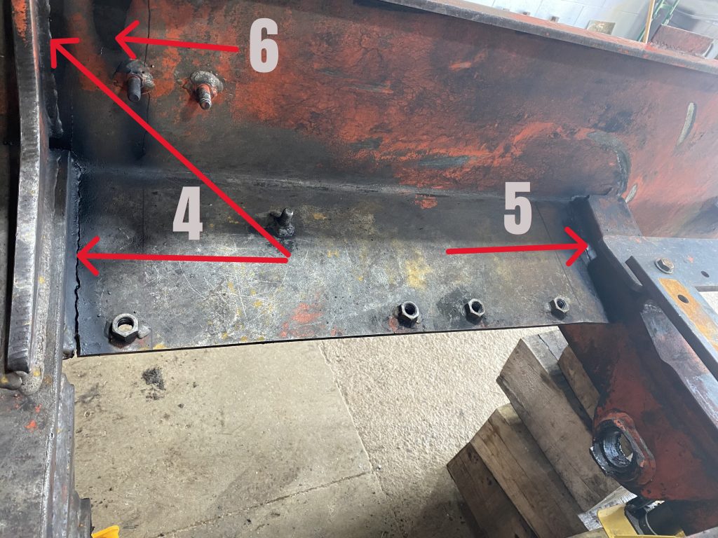 Cracks 4, 5 and 6 as they are visible from inside frame on the left side of skidder. All cracks are marked with numbers and red arrows point to them. The image presents the extensive damages on the left hand side. August 11, 2025 for JW Portable Welding & Repairs, Lucan Ontario