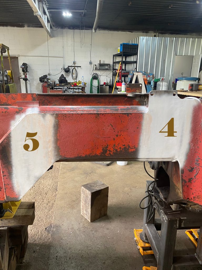 MPT contrast paint on the outside plates located on the left hand side of the frame. These areas are prepared for in house MPT testing. The numbered spots correspond to numbered cracks in these locations that has been repaired. August 13, 2025, for JW Portable Welding & Repairs, Lucan Ontario.