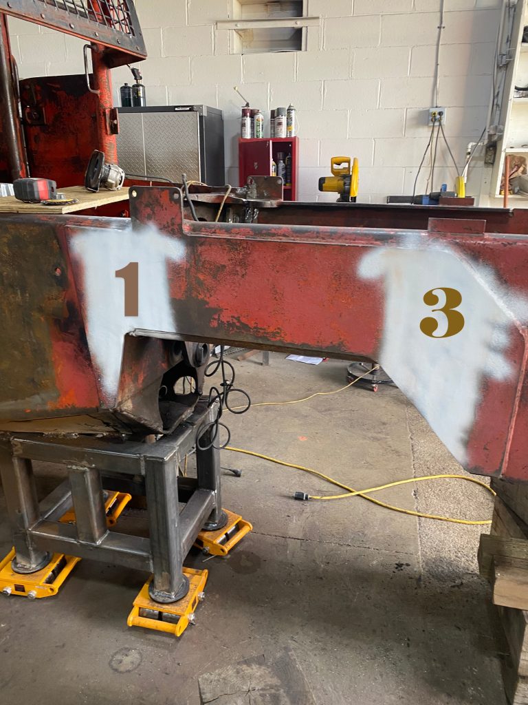 MPT contrast paint on the outside plates located on the right hand side of the frame. The numbered spots 1 and 3 correspond to cracks in these locations that has been repaired. These areas are ready for MPT testing. The contrast paint is in white colour. August 13, 2025, for JW Portable Welding & Repairs, Lucan Ontario.