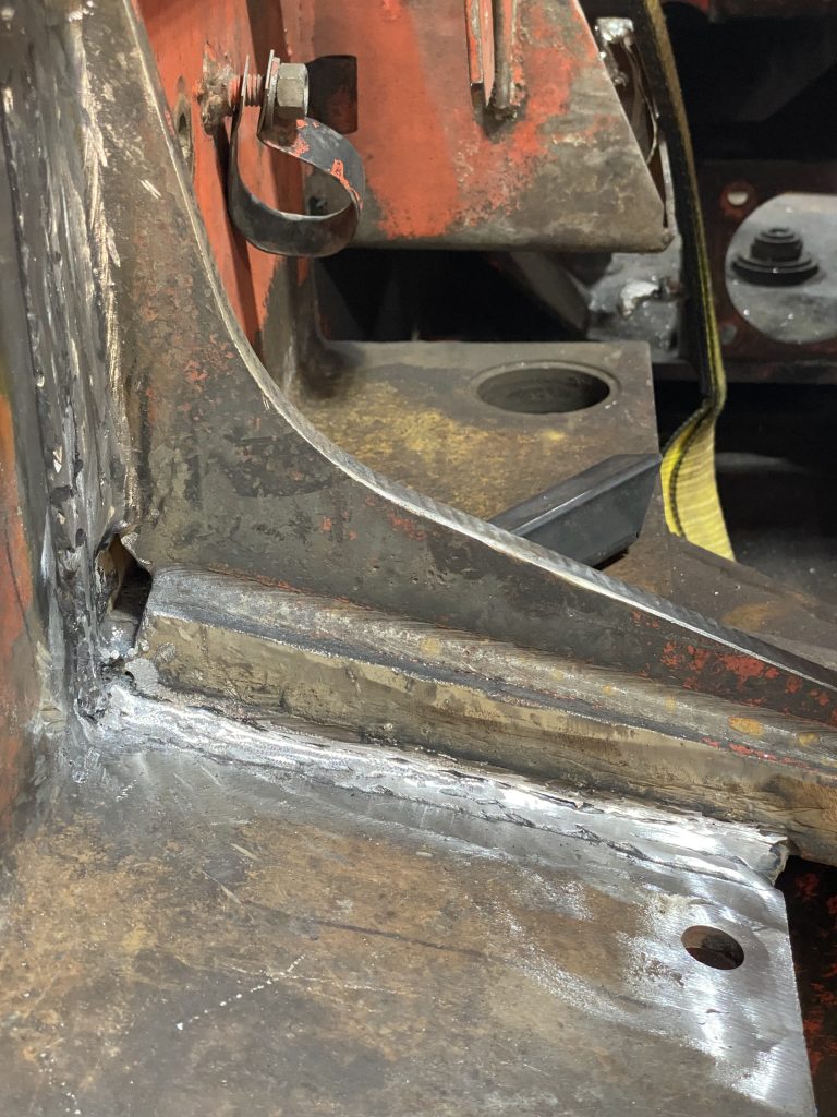 The closeup of repaired weld for crack 1 on horizontal and vertical plates as visible from inside the frame. The welds are cleaned and modeled for MPT testing. The repair welds fix the crack and then if possible the fishplate is welded on top of them. August 11, 2025, for JW Portable Welding & Repairs, Lucan Ontario