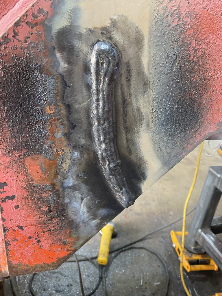 Weld repaired crack # 5 prior grinding its cap. The weld repair has been created in constant temperature settings as it is clearly recognizable based on smoothness of welding passes. August 12, 2025, for JW Portable Welding & Repairs, Lucan Ontario.