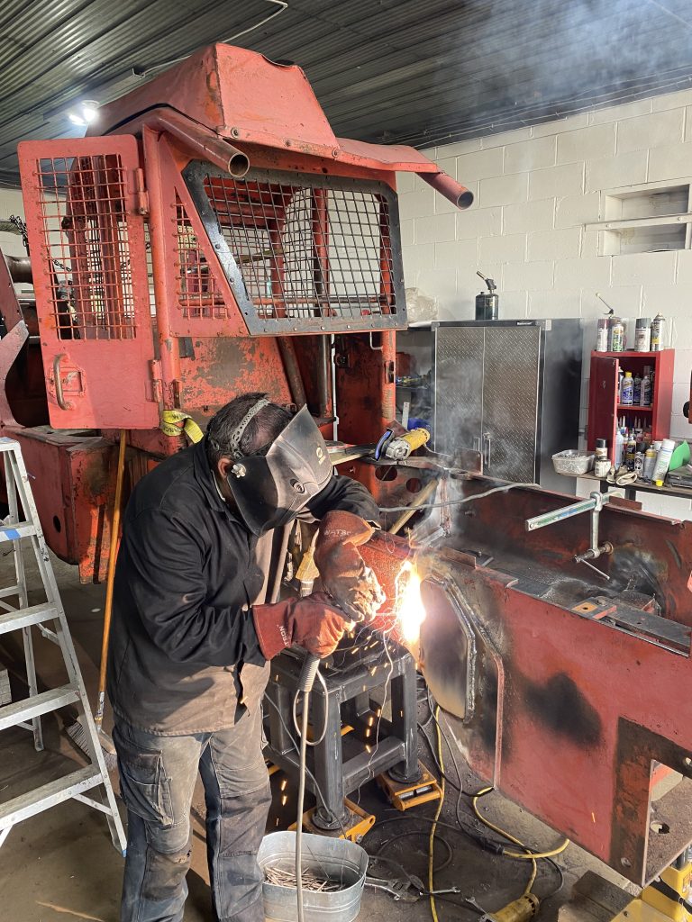 Welder is welding fishplate # 3 with high tensile rods creating 3/8 of an inch fillet weld surrounding the fishplate. The monitoring system for temperature control has been removed. August 13, 2025, for JW Portable Welding & Repairs, Lucan Ontario.