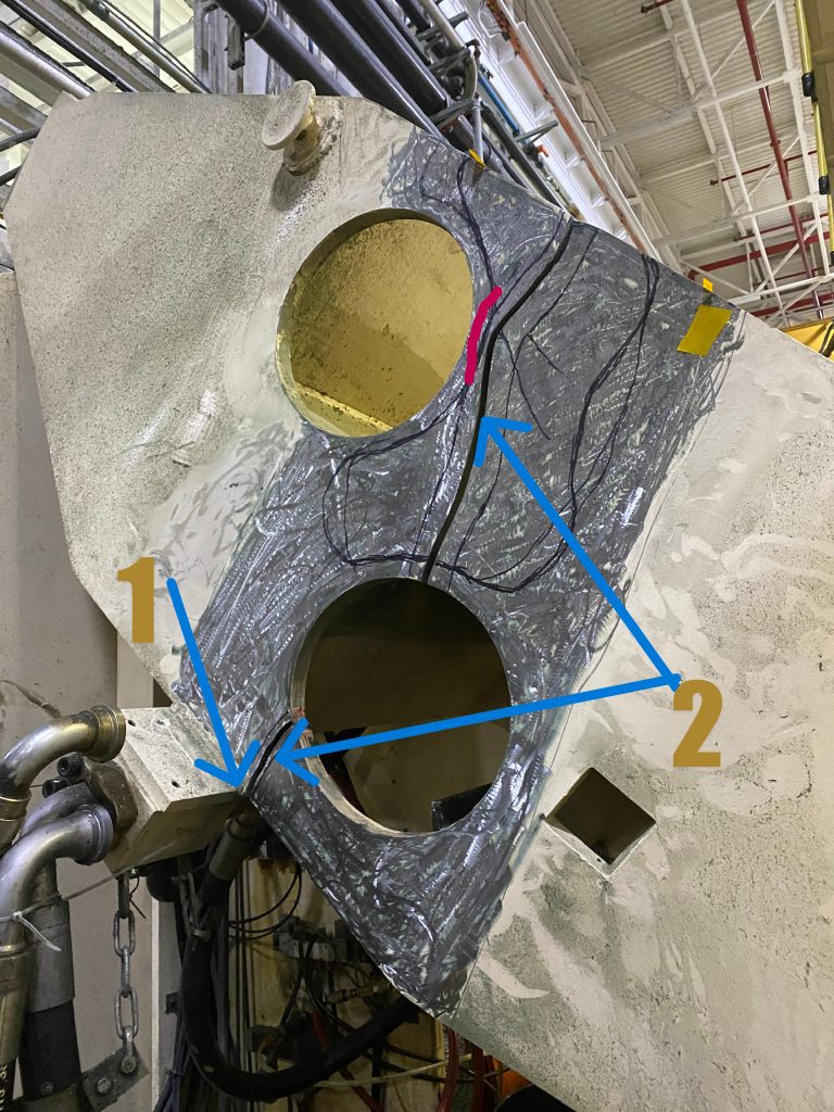 This heavy equipment repair will involve welding of material crack #2 that has penetrated the plate 1.25 inches thick and is 22 inches long. The crack location is marked by two blue arrows. The crack has began at point 1 marked by the another blue arrow. The red mark signals the resistance plane in form of the rib that is located on another side of this plate. The crack gap ranges from 0.4 to 0.5 inch. JW Portable Welding & Repairs, Brampton, Ontario, June 4, 2024