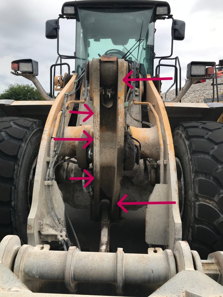 This large Kawasaki loader will not be repaired due to bowing of steel casted element. The red arrow indicate direction of bowing. This equipment will be sold for parts. JW Portable Welding & Repairs, Chatham Ontario, August 28,2025