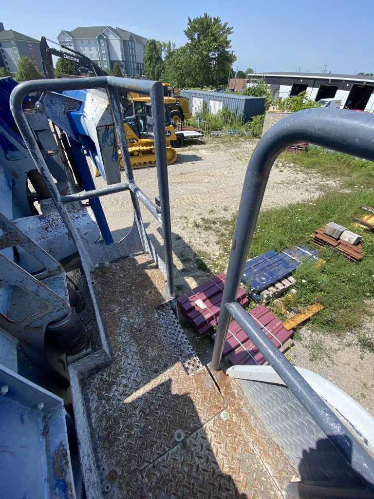 The deck has missing gate leading to the ladder. The missing gate forms a fall hazard for operator.