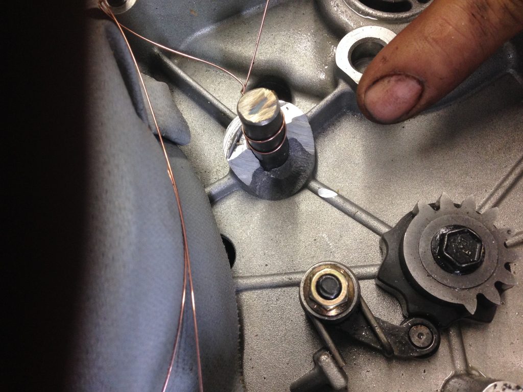 Damaged to poorly designed seat of the steel pin in an ATV's gear box. The aluminum cast has completely fell off from one side of the steel pin. The repair is much less expensive than a new gear box. For JW Portable Welding, 2016, London Ontario