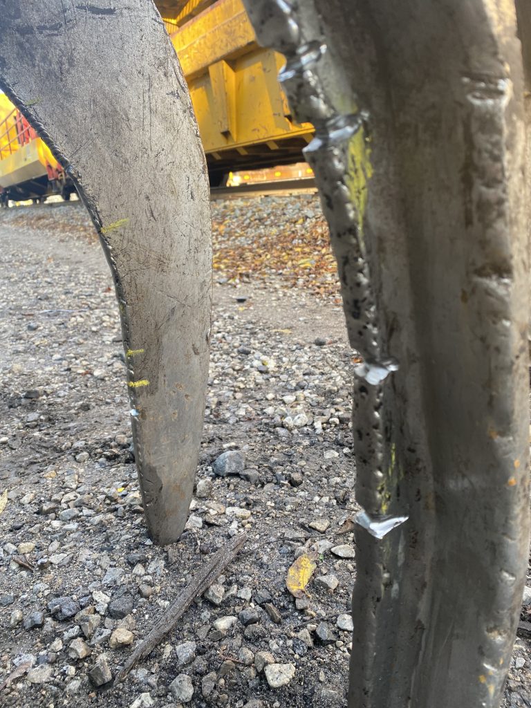 Multiple grooved cracks on grapple arms that will be welded up with surfacing rods The welding parameters will indicate a higher amperage than usual. London ON, 2024, JW Portable Welding & Repairs.