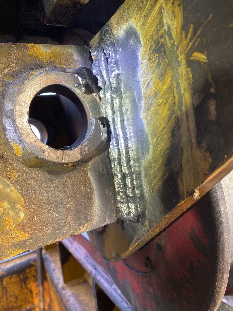 he right wheel vertical weld on wheel side frame. This wheel is relatively less damaged since the railway crane usually operates on the other side. JW Portable Welding & Repairs, 2024 London ON.