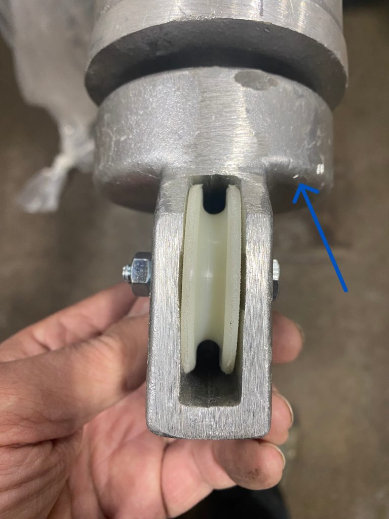 The modified fabricated aluminum tip contains sheave with axle distance to the center of 1.75" bigger than original tip and the bearing is located in the hub marked by blue arrow. Our aluminum re-fabrication did not damaged the bearing in the hub since it was done under controlled temperatures. For JW Portable Welding, 2025, Shop in Lucan, Ontario