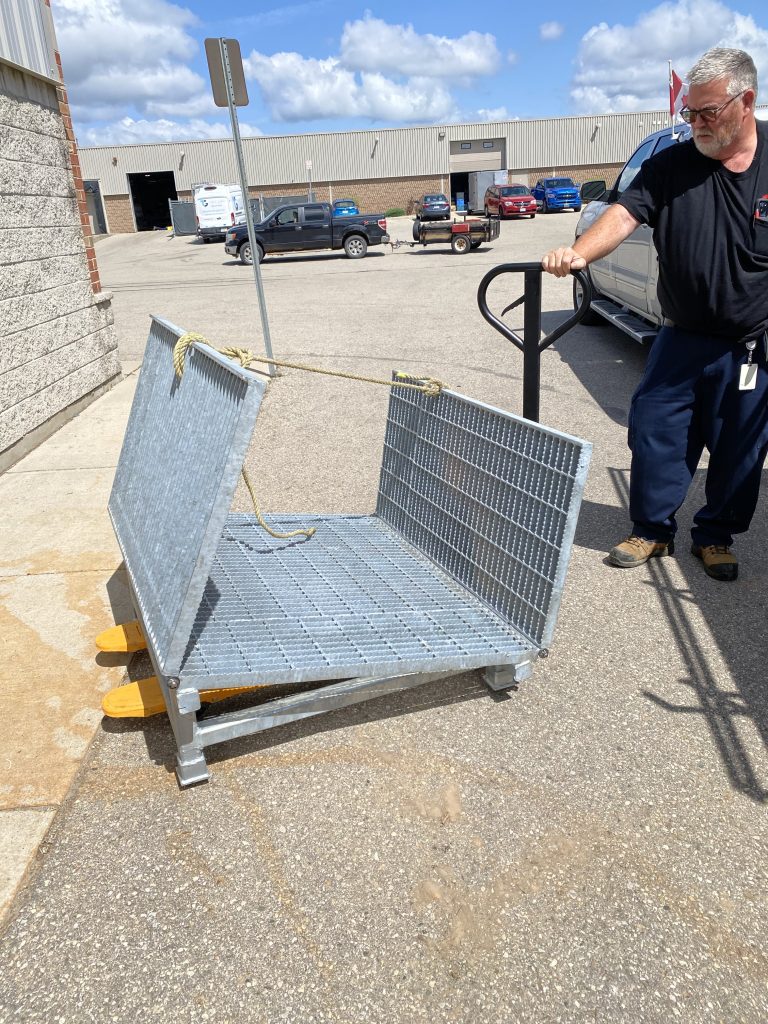 Folded small ramp rated for 800lbs can be moved with a pump truck. Designed by JW Investrade Inc. Fabricated by JW Portable Welding & Repairs, London, 2024