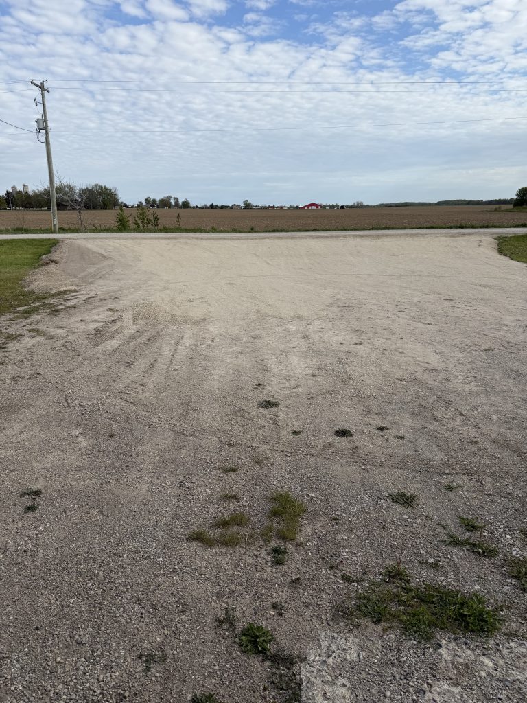 New gravel driveway to welding shop is 75 feet wide with a smooth slope making turns from Clandeboye dr. very comfortable with a large heavy equipment. For JW Portable Welding & Repairs , 2026, Lucan