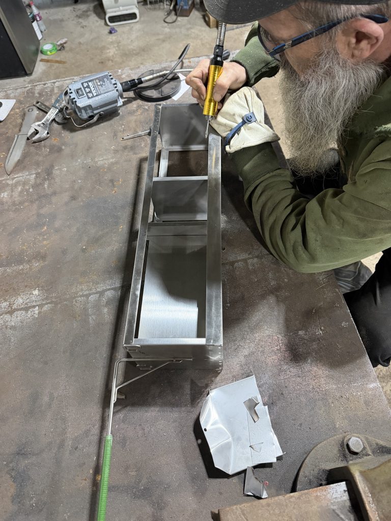 Laboratory equipment repair. Removal of shelves that handle human tissue in cryogenic chamber. Then polishing cuts and modifications. For JW Portable Welding & Repairs, 2026, Lucan