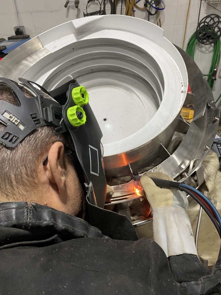 Medical equipment repair. Cracked vibration bowl made from 318 stainless steel with plastic liner being welded GTAW. For JW Portable Welding & Repairs, Lucan, 2025