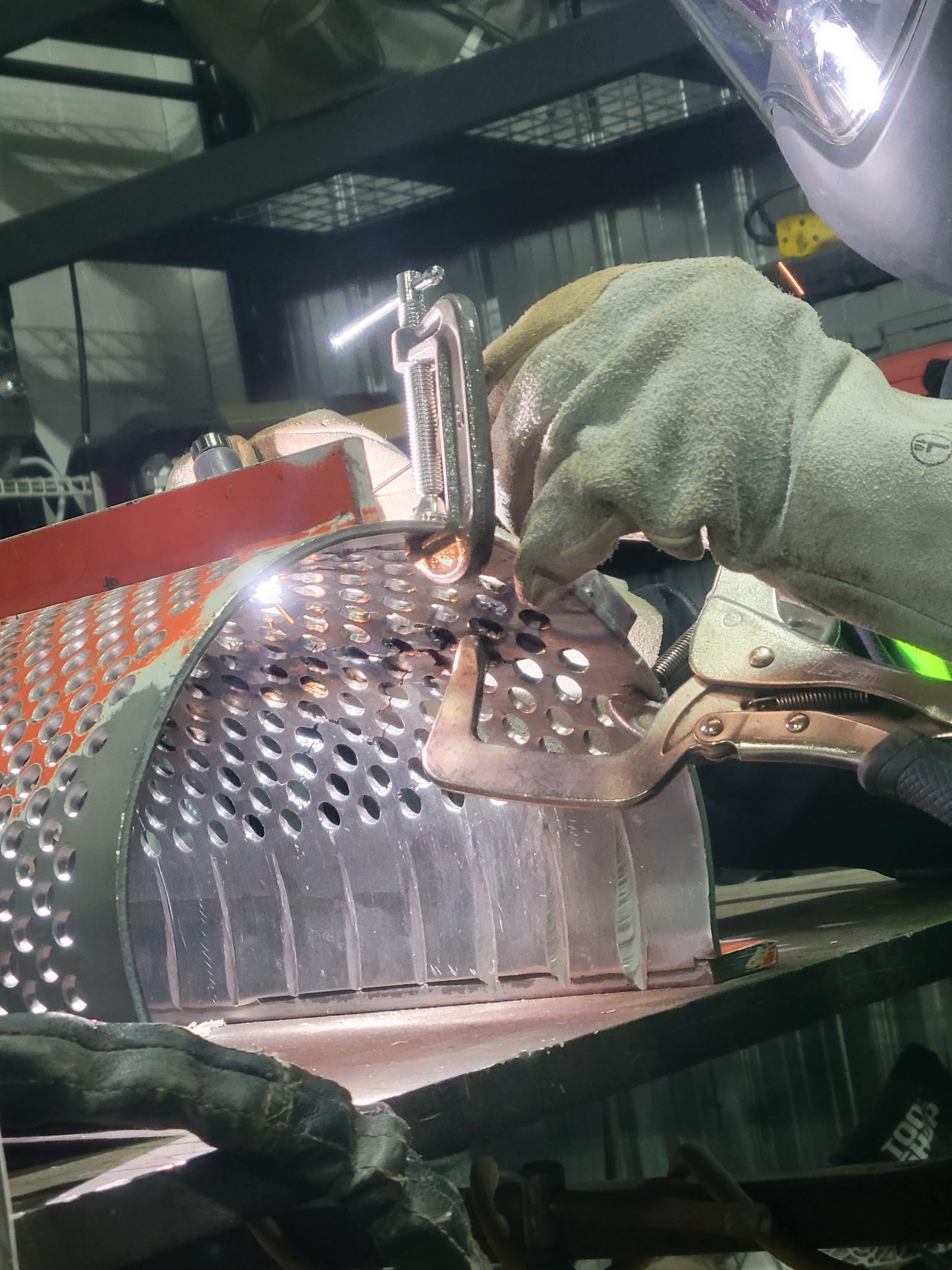 Welding of stainless steel, 308 GTAW, of industrial equipment strainer with multiple cracks and damages. The C clamp and the quick hand hold the broken piece. The stainless strainer has 8 wore out grooves that need to be repaired. The first groove has penetrated Through the wall. For JW Portable Welding & Repair, 2025, London