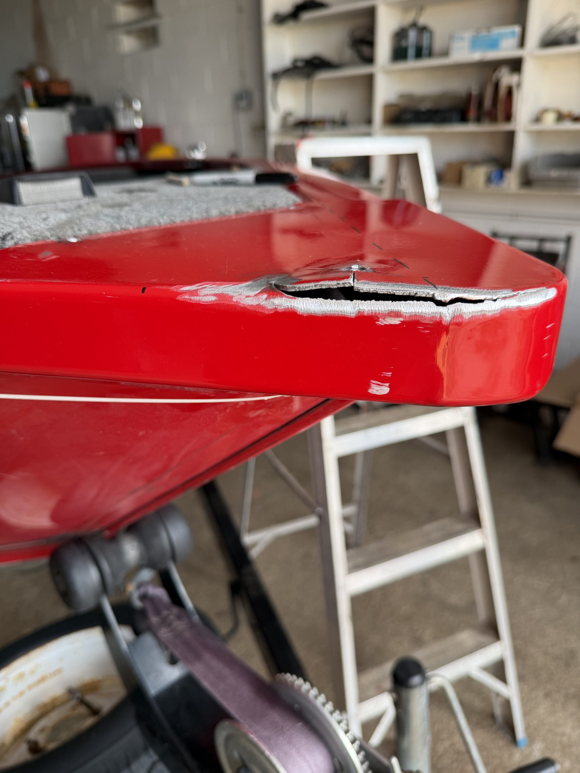 6 inch crack with multiple micro - cracks in the bow of aluminum boat. This aluminum boat repair will involve modification to place the trolling motor mount on stronger one plane to increase resistance to vibration fatigue. For JW Portable Welding & Repairs, Lucan , 2026