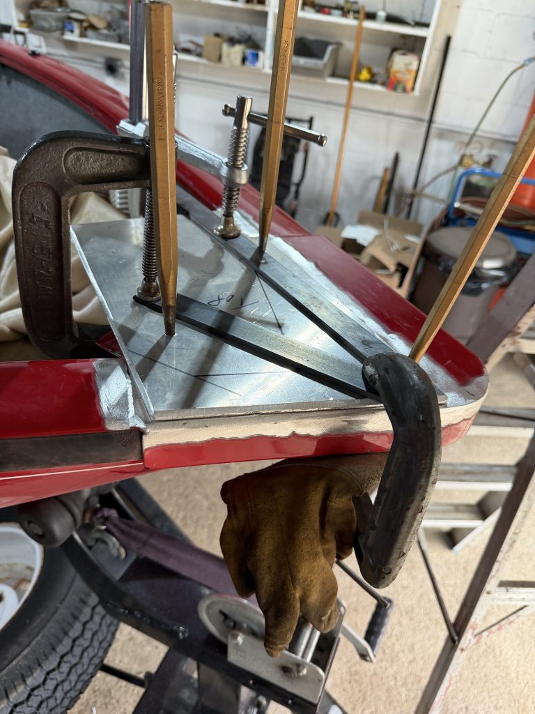 The alignment of new aluminum modification to the shape of aluminum boat is always challenging. In this example we have used 3 locating pins , 3 c-clamps, and 2 flat bars to align the plate. Please notice that the 6 inch crack is already welded up and the weld is buffed to the contour of the edge. For JW Portable Welding & Repairs, Lucan, 2026.