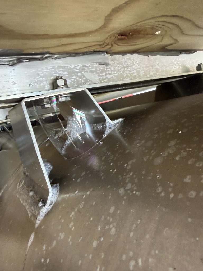 Intense air leak on the aluminum pontoon during during pressure testing. The large air bubbles and characteristic hissing noise help to locate holes during pressure testing of the pontoon. For JW Portable Welding, Lucan , 2026